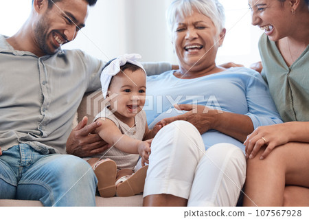 Causing quite a stir. Shot of a family spending time together on a sofa at home. Causing quite a stir. Shot of a family spending time together on a sofa at home. 107567928