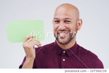 Happy man, portrait and smile with speech bubble for question, social media or FAQ against white studio background. Male person smiling with shape, symbol or sign for comment, message or mockup space 107568139