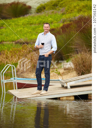 Portrait, lake and mature man with red wine, vacation and smile on a weekend break, getaway and happiness. Face, male person and happy guy on a summer holiday, alcohol and outdoor to relax and chill Portrait, lake and mature man with red wine, vacation and smile on a weekend break, getaway and happiness. Face, male person and happy guy on a summer holiday, alcohol and outdoor to relax and chill 107568142