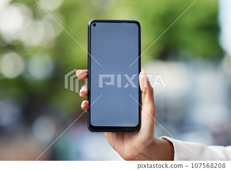 Blank phone screen, mockup and marketing, advertising and mobile brand app space in urban city. Closeup hands of woman holding internet technology, social media website contact and www connect online Blank phone screen, mockup and marketing, advertising and mobile brand app space in urban city. Closeup hands of woman holding internet technology, social media website contact and www connect online 107568208