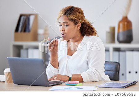 Voice note, phone and business woman talking, recording message and speaking with laptop in office. Communication, networking and female worker with smartphone for planning, schedule and contact Voice note, phone and business woman talking, recording message and speaking with laptop in office. Communication, networking and female worker with smartphone for planning, schedule and contact 107569588