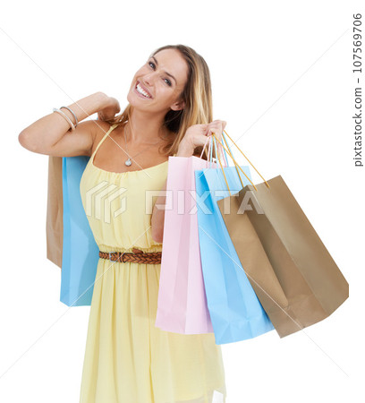 Shopping bag, white background and woman for marketing, promotion or advertising of sale or discount deal. Shopping, wealth and rich customer in studio for spring or summer fashion in commerce choice 107569706