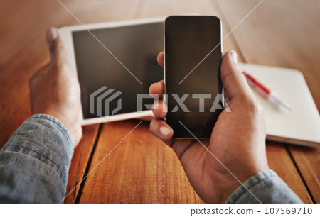 POV, person and cellphone with a screen, tablet and social media with connection, network and digital chatting. Closeup, hands and technology for online reading, website search and mobile application POV, person and cellphone with a screen, tablet and social media with connection, network and digital chatting. Closeup, hands and technology for online reading, website search and mobile application 107569710