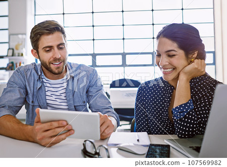 Tablet, business man and woman reading email or social media for ideas in creative project in content marketing. Internet, planning proposal for website and designer in tech startup or design agency. 107569982