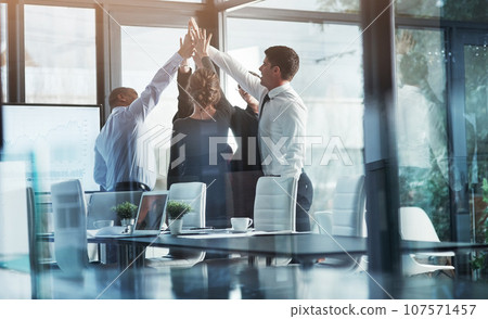 Business people, high five, team building and winning with success, celebration and support in meeting. Mission, professional mindset and teamwork with corporate group, partnership and collaboration Business people, high five, team building and winning with success, celebration and support in meeting. Mission, professional mindset and teamwork with corporate group, partnership and collaboration 107571457