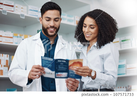 Pharmacy, medicine and brochure with people in store for medical, information and shopping. Healthcare, wellness and expert with man and woman reading in dispensary for medical, product and seller Pharmacy, medicine and brochure with people in store for medical, information and shopping. Healthcare, wellness and expert with man and woman reading in dispensary for medical, product and seller 107571733