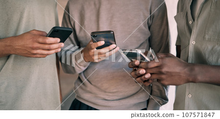 Man, hands and phone of people networking on social media, mobile app or chatting together. Hand of men holding smartphone texting or typing for online network share, data sync or communication 107571847