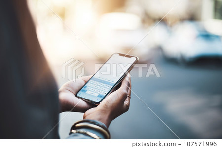 Woman, hands and phone screen in city for communication, social media or texting outdoors. Hand of female on mobile smartphone keypad display for travel, networking or chatting in urban town street 107571996