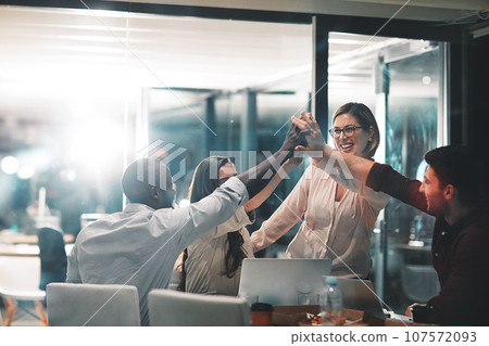 High five, collaboration and business people in celebration in the office for project success. Teamwork, diversity and group of professional employees with team achievement to celebrate in workplace. 107572093