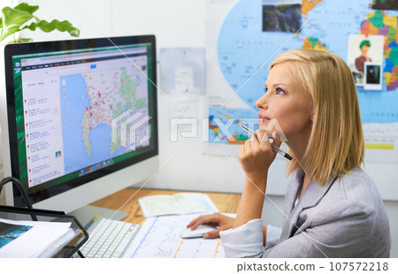 Office computer, travel agent woman and thinking of world, global or international tour, vacation or holiday idea. Digital map, tourism agency and female person dream of plan, solution or ideas Office computer, travel agent woman and thinking of world, global or international tour, vacation or holiday idea. Digital map, tourism agency and female person dream of plan, solution or ideas 107572218