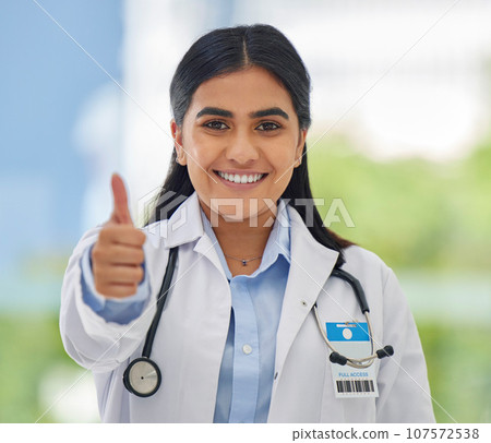 Woman, doctor portrait and thumbs up with hospital success, motivation and yes in clinic. Emoji, winner and like hand sign of a professional healthcare and wellness worker feeling happy from job 107572538