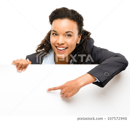 Ready to help your business succeed. Shot of a young businesswoman holding a placard against a studio background. Ready to help your business succeed. Shot of a young businesswoman holding a placard against a studio background. 107572948
