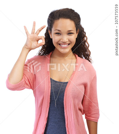 Black woman, portrait and ok hand sign for support, success and approval on white background. Smile and face of a happy female model with perfect finger emoji for motivation, feedback and trust Black woman, portrait and ok hand sign for support, success and approval on white background. Smile and face of a happy female model with perfect finger emoji for motivation, feedback and trust 107573559