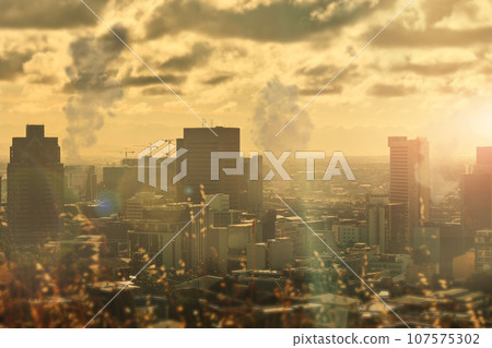 City, pollution and buildings and smoke, clouds and fumes in urban area, environment and climate change. Emissions, power plants and factories in atmosphere, skyline and danger in toxins, gas or air 107575302