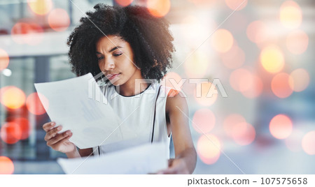 Business woman, documents and confused or reading financial report of budget, accounting or payroll information. African worker or accountant with invoice paperwork or debt in bokeh overlay or mockup Business woman, documents and confused or reading financial report of budget, accounting or payroll information. African worker or accountant with invoice paperwork or debt in bokeh overlay or mockup 107575658