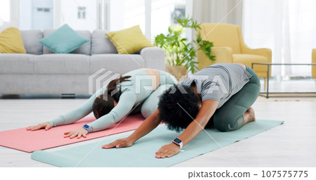 Friends, yoga and women in child pose stretching for wellness, healthy body and training on floor. Balance, performance and people on gym mat for pilates, holistic exercise and workout in living room Friends, yoga and women in child pose stretching for wellness, healthy body and training on floor. Balance, performance and people on gym mat for pilates, holistic exercise and workout in living room 107575775