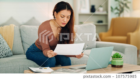 Woman, paper and laptop in living room on sofa working on project, assignment or task for college or business. Student, girl and home to study, for test or exam at university with handheld movement Woman, paper and laptop in living room on sofa working on project, assignment or task for college or business. Student, girl and home to study, for test or exam at university with handheld movement 107575985