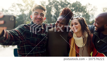 Camping, selfie and friends smile in nature on outdoor holiday, vacation and adventure. Campsite, travel and happy men and women on mountain take photo for social media, profile picture and memories Camping, selfie and friends smile in nature on outdoor holiday, vacation and adventure. Campsite, travel and happy men and women on mountain take photo for social media, profile picture and memories 107576221