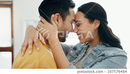 Couple, forehead touch and hug in living room with love, bonding and happy people together at home. Healthy relationship, trust and support in commitment, partner and dancing, romance and intimacy Couple, forehead touch and hug in living room with love, bonding and happy people together at home. Healthy relationship, trust and support in commitment, partner and dancing, romance and intimacy 107576484