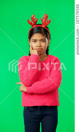 Christmas, thinking and portrait of girl on green screen with arms crossed for idea, thoughts and wondering. Festive, decor and child in studio brainstorming for holiday, celebration and Santa list Christmas, thinking and portrait of girl on green screen with arms crossed for idea, thoughts and wondering. Festive, decor and child in studio brainstorming for holiday, celebration and Santa list 107576588