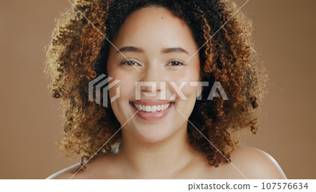 Portrait of happy woman, natural skincare dermatology or cosmetic wellness in studio with smile. Skin glow, model or confident biracial female person with beauty results or pride on brown background 107576634