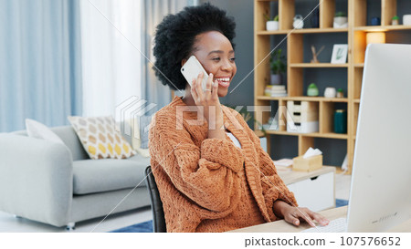 Phone call, computer and smile with a business black woman in her office for communication or networking on project management. Contact, happy and young employee talking on her mobile for negotiation 107576652
