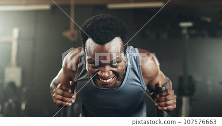 Black man at gym, weight sled and muscle endurance, strong body and core balance power in fitness. Commitment, motivation and bodybuilder in workout challenge for health and wellness on push machine. Black man at gym, weight sled and muscle endurance, strong body and core balance power in fitness. Commitment, motivation and bodybuilder in workout challenge for health and wellness on push machine. 107576663