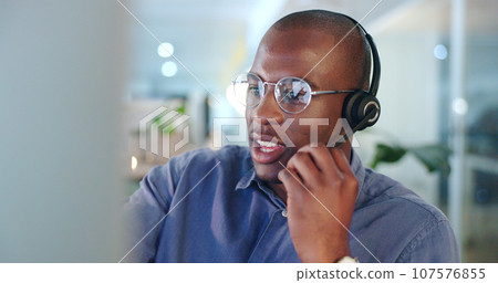 Black man, call center and consulting with headphones in customer service, support or telemarketing at office. African male person, consultant or agent talking for online advice or help at workplace Black man, call center and consulting with headphones in customer service, support or telemarketing at office. African male person, consultant or agent talking for online advice or help at workplace 107576855