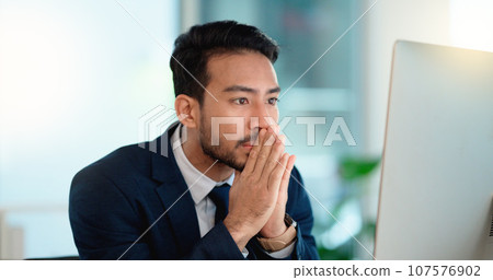 Stressed web developer suffering with mental block while trying to code on a computer in his office. Frustrated data scientist struggling with fatigue and feeling the pressure to hit his deadline 107576902