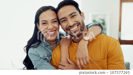 Couple, hug in portrait and relax in lounge with love, bonding and happy people together at home. Healthy relationship, trust and support in commitment, partner and marriage with romance and intimacy Couple, hug in portrait and relax in lounge with love, bonding and happy people together at home. Healthy relationship, trust and support in commitment, partner and marriage with romance and intimacy 107577265