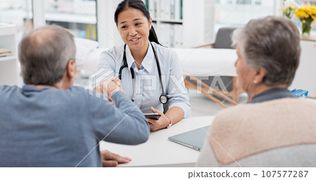 Doctor consultation meeting, elderly couple and handshake for thank you, welcome and agreement for hospital insurance. Healthcare clinic, senior people and cardiology worker shaking hands for goodbye Doctor consultation meeting, elderly couple and handshake for thank you, welcome and agreement for hospital insurance. Healthcare clinic, senior people and cardiology worker shaking hands for goodbye 107577287
