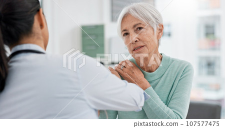 Physiotherapist, senior woman and check shoulder for rehabilitation help, recovery support or joint injury. Chiropractor consultation talk, elderly patient or physiotherapy doctor for medical service 107577475