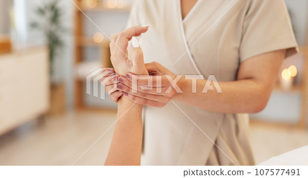Relax, massage and hands of woman in spa for luxury treatment, skincare and wellness with masseuse. Resort salon, beauty and person do manicure for healthy skin, grooming and holistic stress relief Relax, massage and hands of woman in spa for luxury treatment, skincare and wellness with masseuse. Resort salon, beauty and person do manicure for healthy skin, grooming and holistic stress relief 107577491