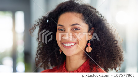 Happy, laughing and the face of a woman at work with pride, happiness and confidence. Smile. cheerful and a portrait of a young corporate employee with positivity, smiling and looking confident 107577905