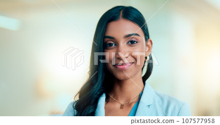 Satisfied, confident entrepreneur doing an online training for a remote, distance job. Closeup face portrait of a successful business woman standing and smiling against a bokeh, copyspace background. 107577958