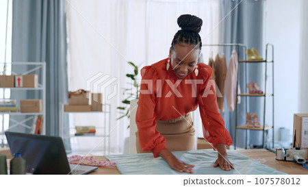 Fashion, designer and black woman with fabric for clothing brand, texture and pattern in workshop. Retail, boutique and person with material for creative startup, small business and store in studio Fashion, designer and black woman with fabric for clothing brand, texture and pattern in workshop. Retail, boutique and person with material for creative startup, small business and store in studio 107578012