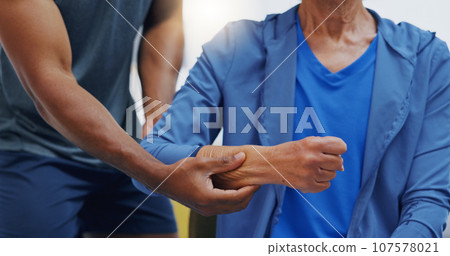 Hands, physiotherapy and recovery with a patient training while listening to her therapist for rehabilitation. Healthcare, fitness or exercise with a person and physiotherapist during a workout 107578021