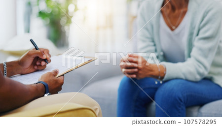 Woman, hands or consulting a therapist writing on clipboard notes for healthcare service of cancer therapy. Closeup, psychology help or patient talking in counseling with paperwork report documents 107578295