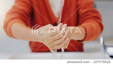 Washing hands, water and cleaning at sink in bathroom for hygiene, wellness or health. Skincare, liquid and woman clean hand to remove bacteria, germs and dirt, sanitary and disinfection in home. Washing hands, water and cleaning at sink in bathroom for hygiene, wellness or health. Skincare, liquid and woman clean hand to remove bacteria, germs and dirt, sanitary and disinfection in home. 107578426