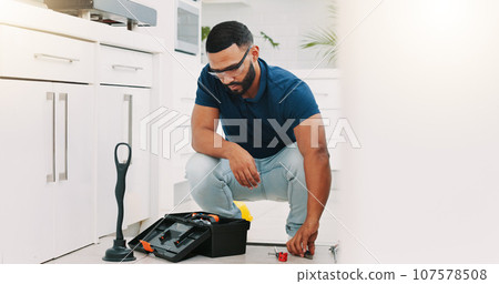 Plumber man, tools and box on floor maintenance with packing, focus and pipe repair service in house. Entrepreneur handyman, plumbing expert and small business owner with toolbox in home kitchen 107578508