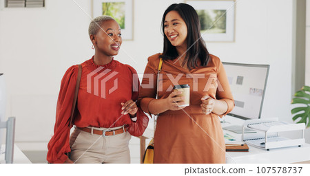 Business people, walking and happy conversation in an office with coffee, smile or friendly chat. Work, friends and women with diversity, discussion or gossip, news or project, idea or communication Business people, walking and happy conversation in an office with coffee, smile or friendly chat. Work, friends and women with diversity, discussion or gossip, news or project, idea or communication 107578737