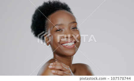 Face, skincare and beauty of happy black woman in studio isolated on a gray background mockup space. Portrait, natural cosmetics and African model in spa facial treatment, wellness and skin health Face, skincare and beauty of happy black woman in studio isolated on a gray background mockup space. Portrait, natural cosmetics and African model in spa facial treatment, wellness and skin health 107578744