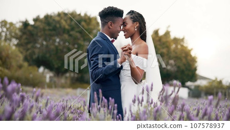 Wedding, dancing and black couple in garden for reception, celebration and excited future together. Gazebo, man and woman with smile at marriage with flowers, music and happiness at party in nature. Wedding, dancing and black couple in garden for reception, celebration and excited future together. Gazebo, man and woman with smile at marriage with flowers, music and happiness at party in nature. 107578937