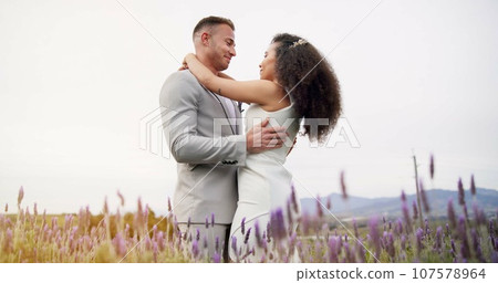 Wedding, dance and couple in garden with love, celebration and excited for future together. Field, happy man and woman at boho marriage reception with flowers, music and commitment at party in nature 107578964
