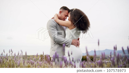Outdoor, hug and couple with celebration, wedding and romance with marriage, happiness and countryside. Man, happy woman and embrace with commitment, love and bride with groom, summer and romantic 107578973