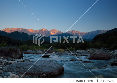 Hakuba mountain range and riverside stones in the morning sun Hakuba mountain range and riverside stones in the morning sun 107578980