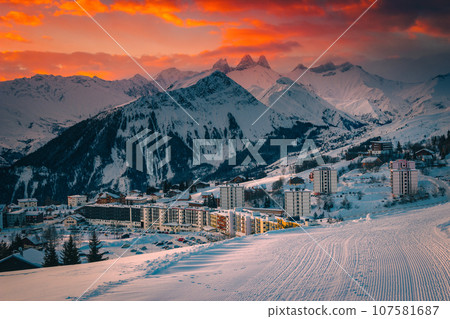 Alpine ski resort with buildings at sunrise, La Toussuire, France Alpine ski resort with buildings at sunrise, La Toussuire, France 107581687