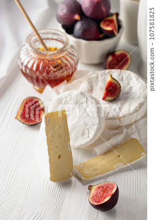 Camembert cheese with figs and honey. 107581825