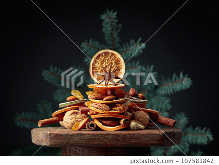 Christmas still-life with dried fruits and nuts. 107581842