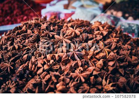 Heap of star anise spices 107582078